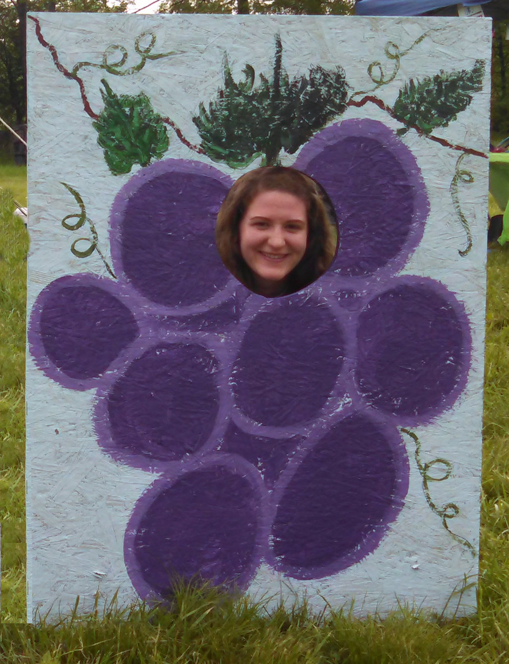 Abby Johnson in a grape bunch cutout 