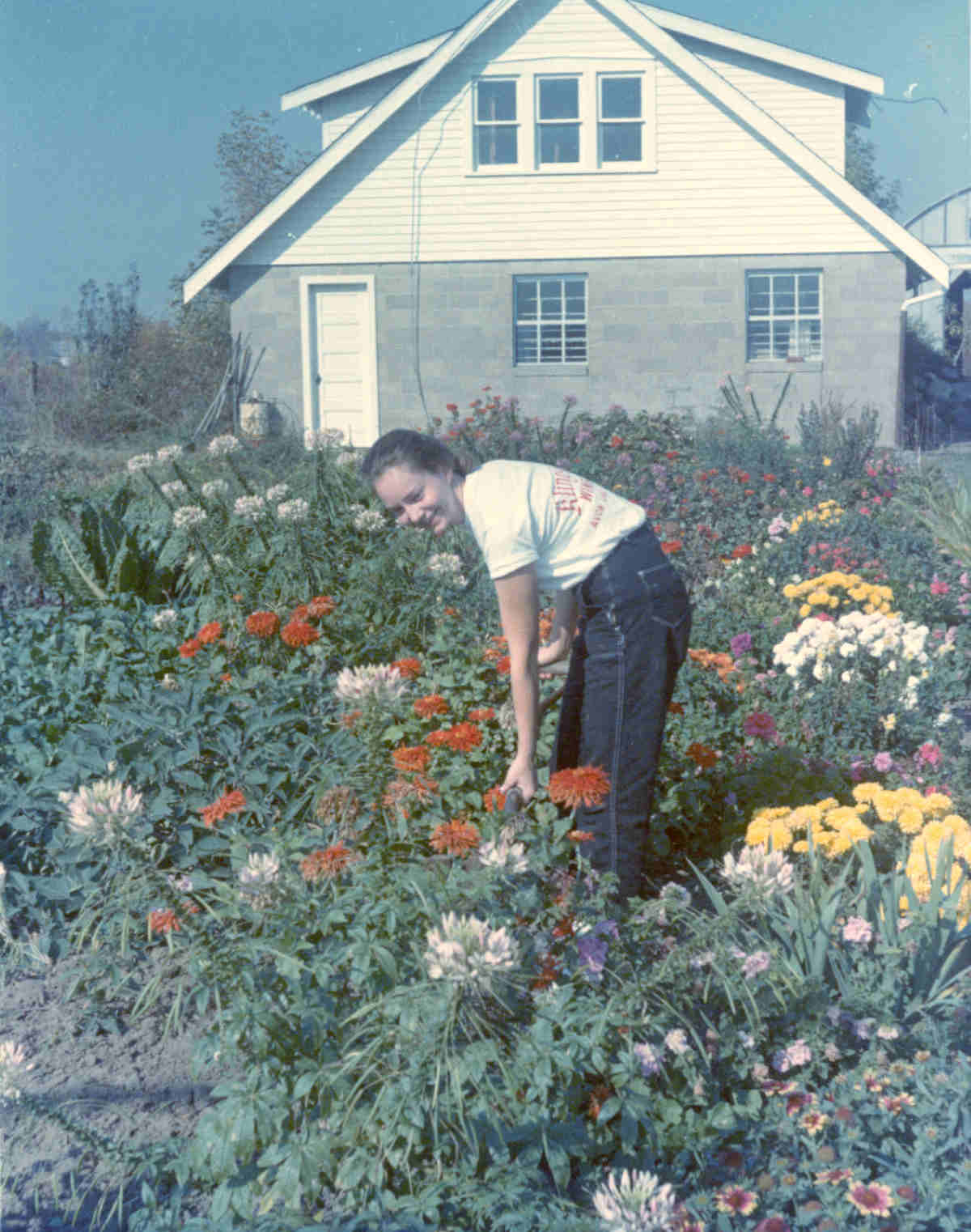 Barbara Klingshirn in her flower garden at the front of the original winery